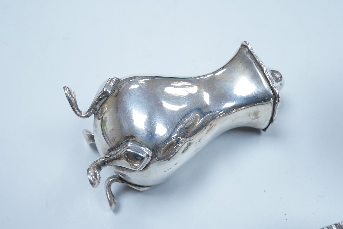 Two George VI silver three piece condiment sets by Walker & Hall, London, 1936/7, together with a modern silver mounted pepper mill by Mappin & Webb and two plated spoons.